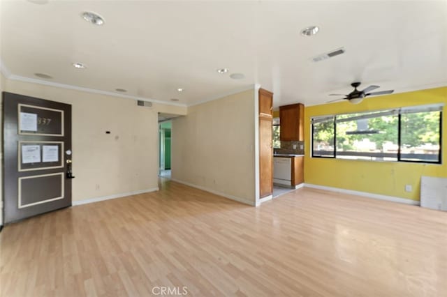 unfurnished living room with crown molding, ceiling fan, and light wood-type flooring