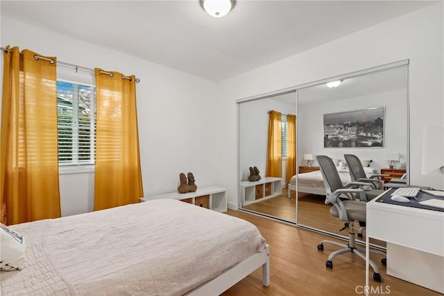 bedroom featuring a closet and hardwood / wood-style floors