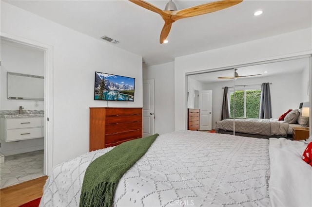 bedroom with ceiling fan and hardwood / wood-style floors