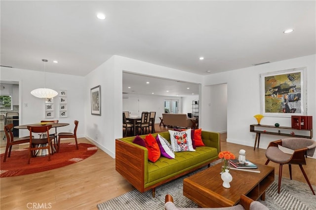 living room with light hardwood / wood-style flooring