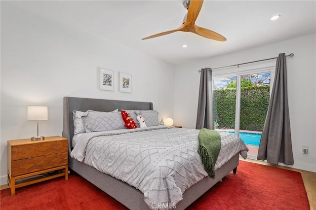 bedroom with dark wood-type flooring, ceiling fan, and access to exterior