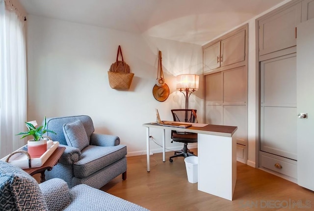 home office with light wood-type flooring