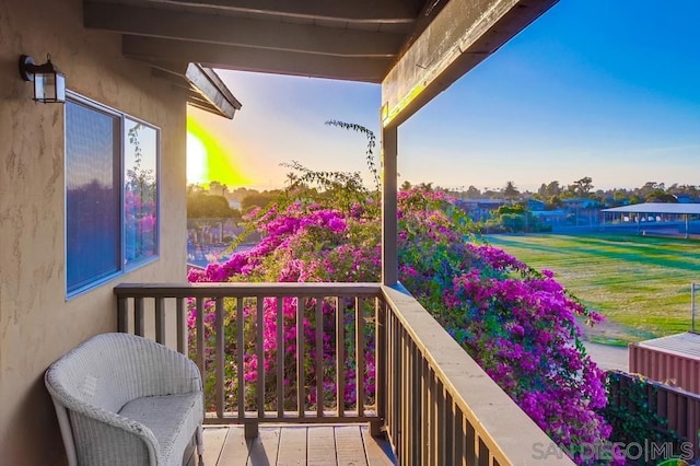 view of balcony at dusk