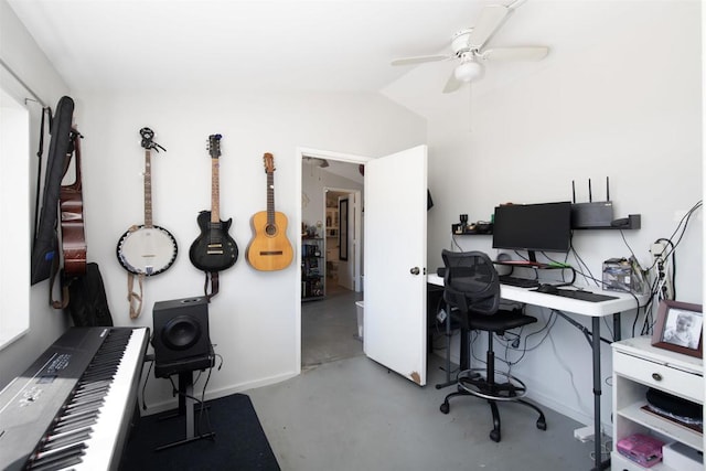 office with ceiling fan, vaulted ceiling, and concrete floors