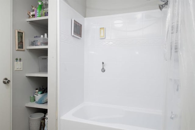 bathroom with shower / bath combo with shower curtain