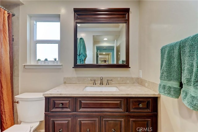 bathroom with vanity and toilet