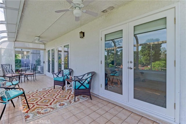 view of patio with french doors and ceiling fan