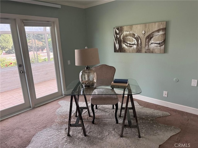 carpeted office space featuring crown molding