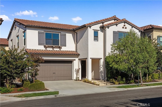 mediterranean / spanish-style home featuring a garage