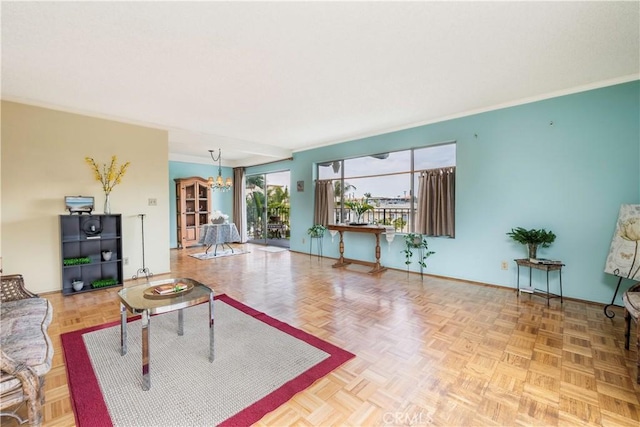 191 Kennebec Ave Unit 301, Long Beach, CA 90803 - living area featuring a chandelier, baseboards, and ornamental molding