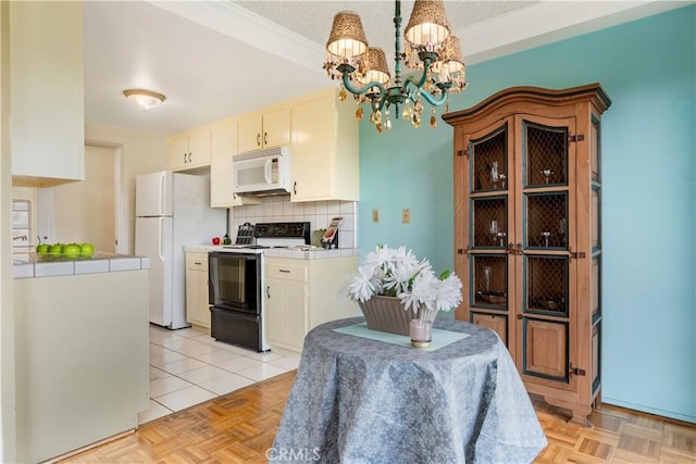 dining room featuring a chandelier and ornamental molding