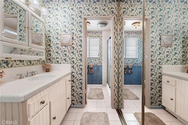 191 Kennebec Ave Unit 301, Long Beach, CA 90803 - bathroom featuring wallpapered walls, vanity, tile patterned floors, and a stall shower