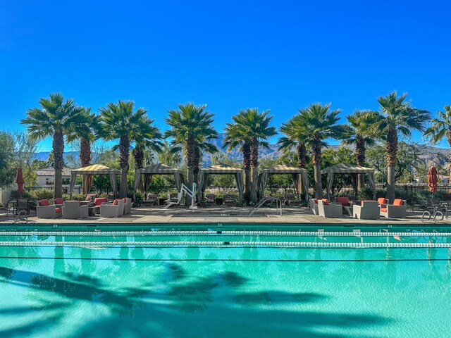 view of pool with a patio, a gazebo, and outdoor lounge area