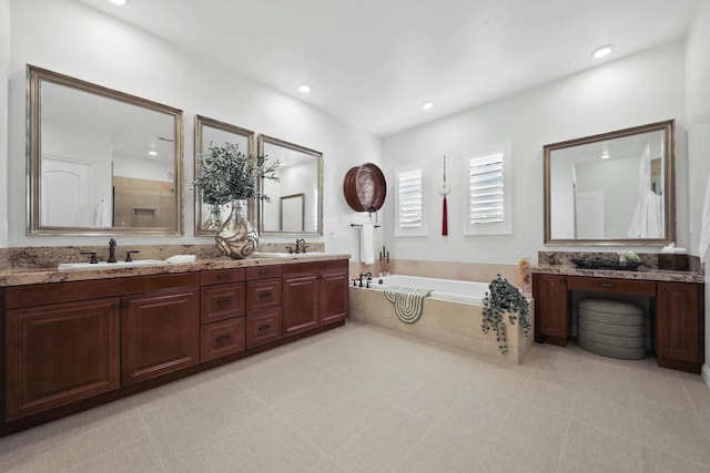 bathroom featuring vanity and separate shower and tub