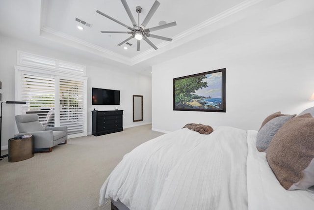 bedroom with light carpet, crown molding, a raised ceiling, and ceiling fan