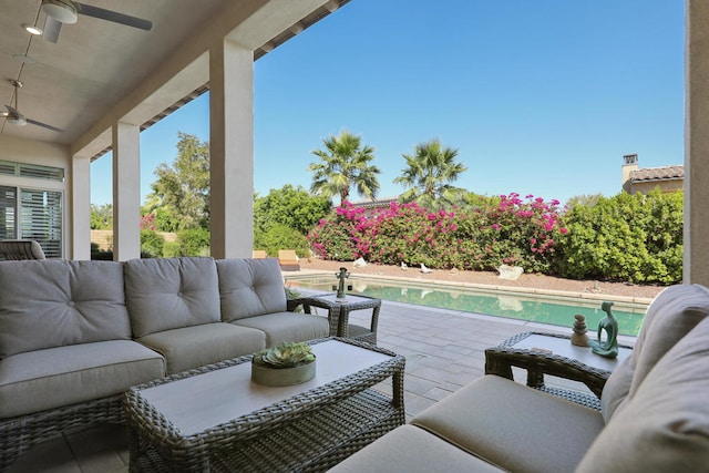 view of patio / terrace featuring an outdoor living space and ceiling fan