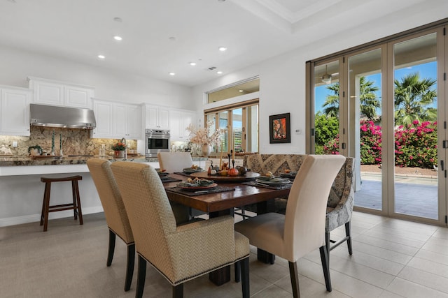 tiled dining area featuring a wealth of natural light