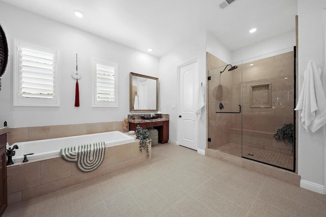 bathroom featuring vanity and plus walk in shower