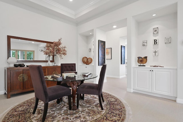 dining area with ornamental molding and light carpet