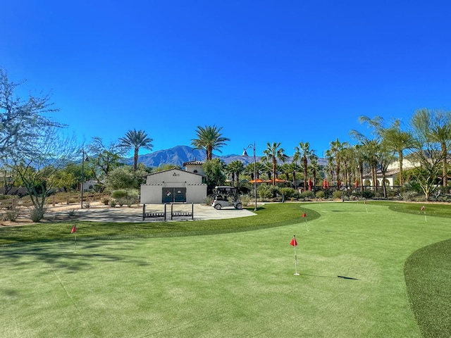 surrounding community featuring a patio and a mountain view