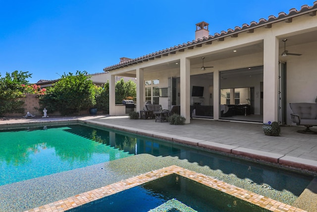 view of pool with a patio area and ceiling fan