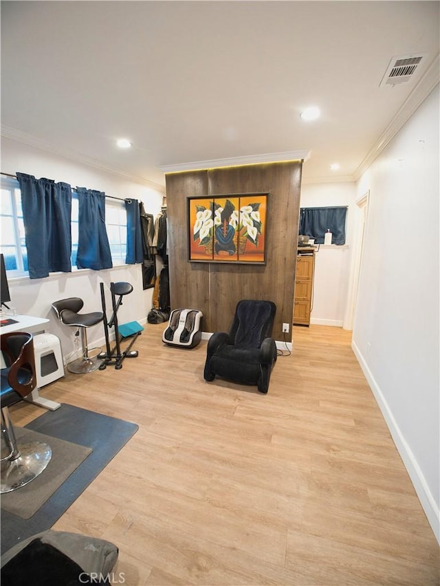 workout area with recessed lighting, wood finished floors, visible vents, baseboards, and crown molding