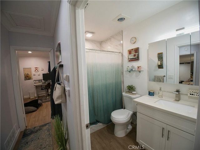 full bathroom with toilet, a shower with shower curtain, wood finished floors, and vanity