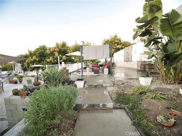 view of yard with a fenced backyard, a patio, and outdoor lounge area