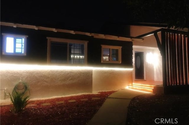 interior space with stucco siding