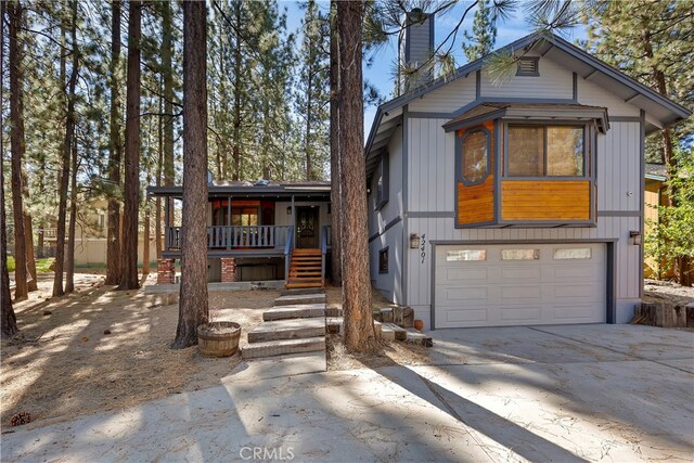42401 Avalon Rd, Big Bear Lake, CA 92315 - rustic home featuring a garage, a porch, stairway, a chimney, and driveway