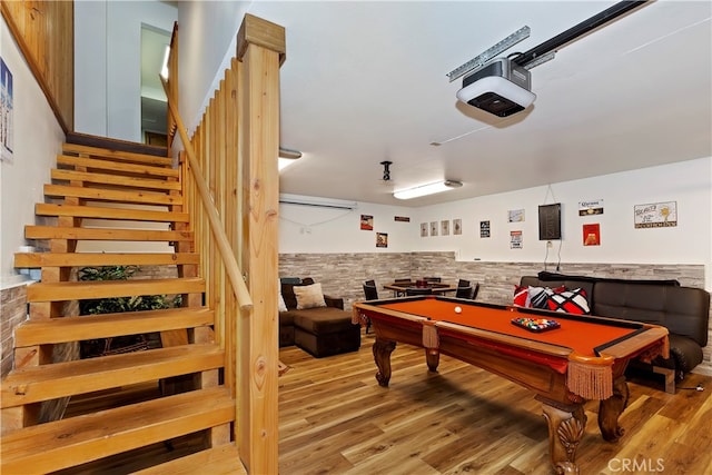 rec room with light hardwood / wood-style flooring and billiards