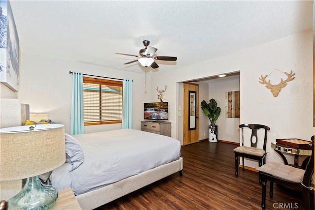 bedroom featuring dark hardwood / wood-style floors, a textured ceiling, and ceiling fan