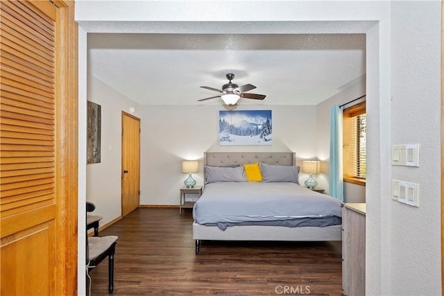 bedroom featuring dark hardwood / wood-style flooring and ceiling fan