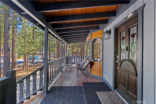 wooden terrace with french doors and covered porch