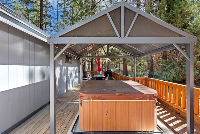 wooden deck featuring a gazebo and a hot tub