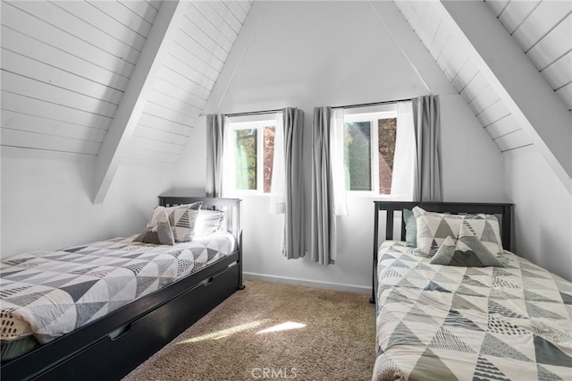 bedroom with carpet floors and lofted ceiling with beams