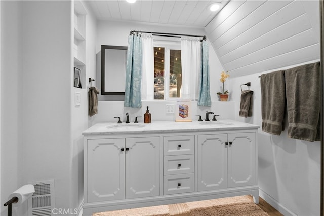 bathroom with vanity, lofted ceiling, and wooden ceiling