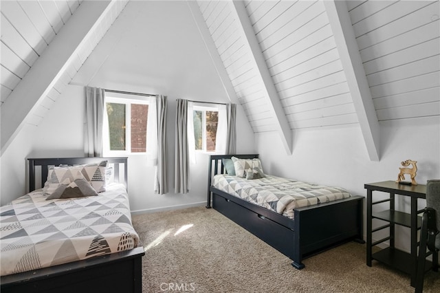 carpeted bedroom featuring vaulted ceiling with beams