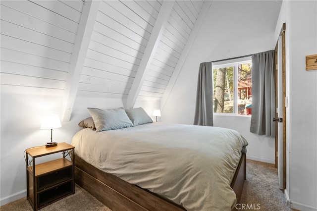 carpeted bedroom featuring lofted ceiling with beams