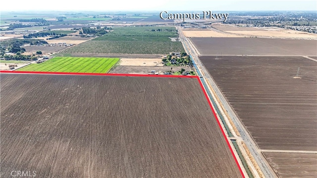 birds eye view of property with a rural view