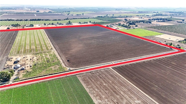 birds eye view of property with a rural view