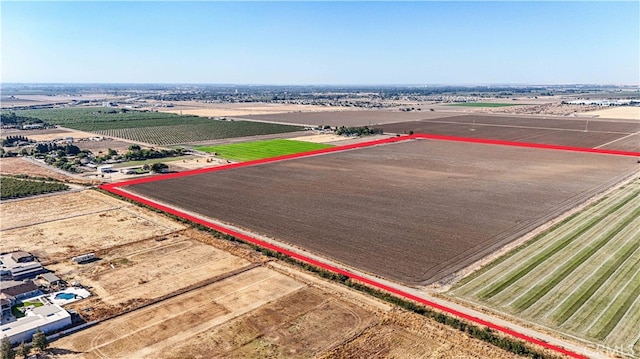 birds eye view of property with a rural view