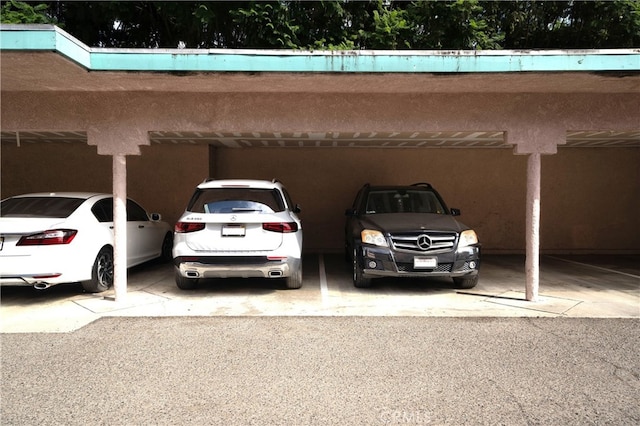 view of vehicle parking with a carport