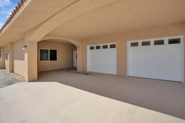 doorway to property with a garage