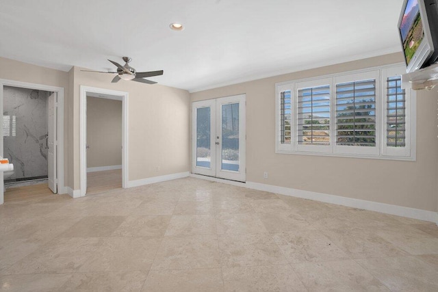 spare room featuring french doors and ceiling fan