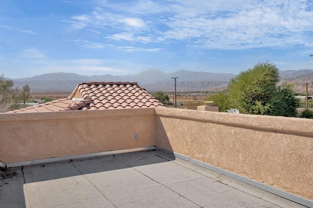 view of patio / terrace featuring a mountain view