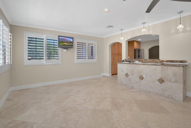 unfurnished room with crown molding