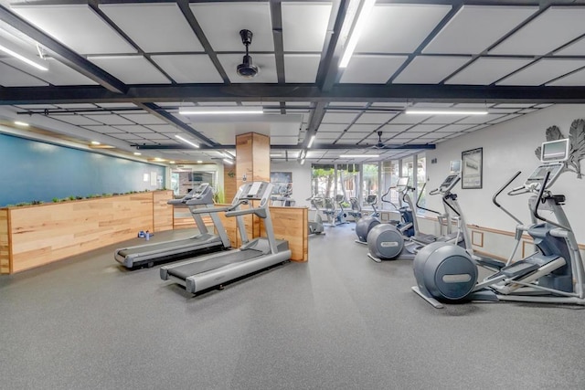 exercise room featuring wooden walls