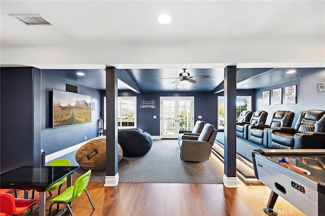 playroom featuring lofted ceiling, hardwood / wood-style flooring, and ceiling fan