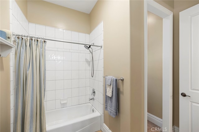 bathroom with tile patterned flooring and shower / bathtub combination with curtain